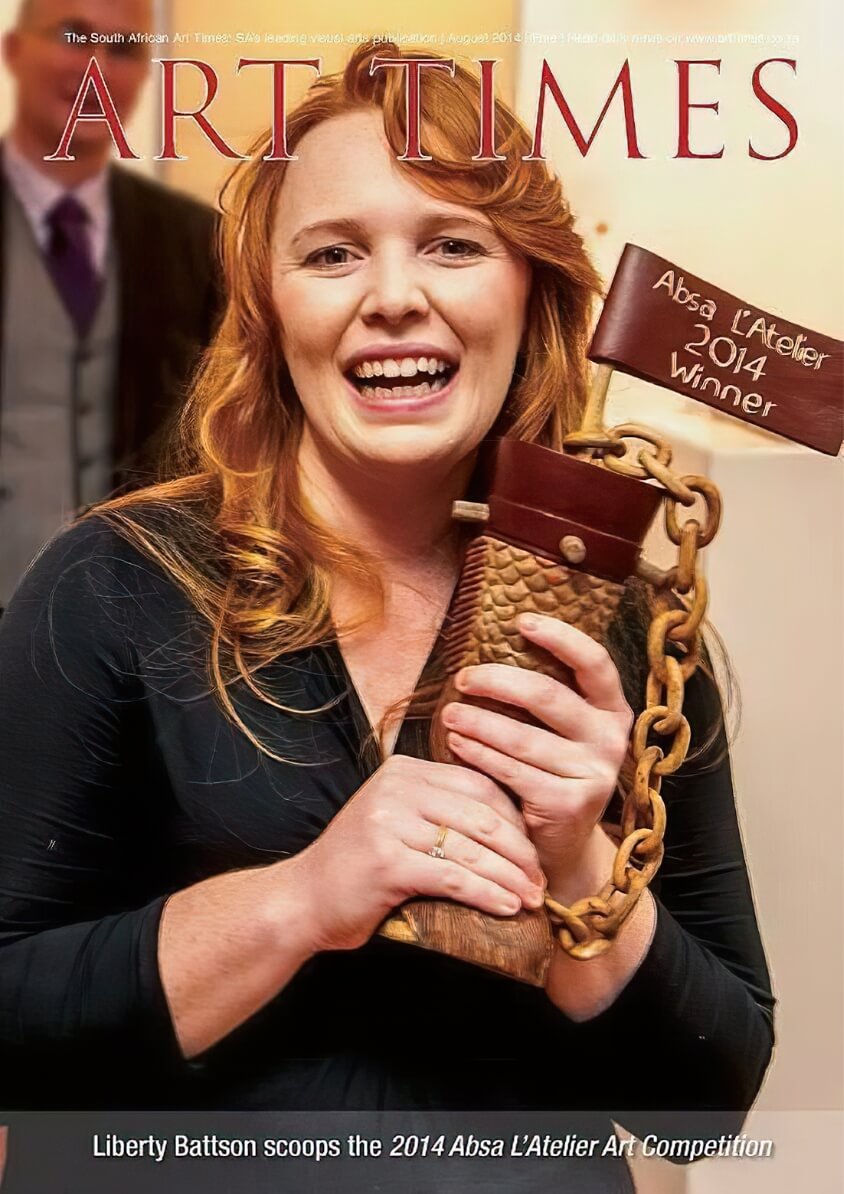 Photo of Liberty holding award trophy